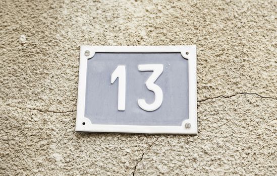 Number thirteen on a wall in a house