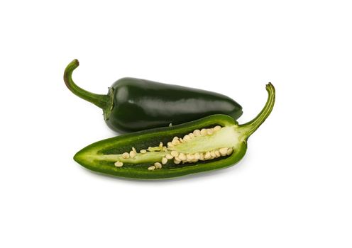 Close up green jalapeno peppers isolated