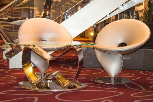 Cruise ship furniture, comfortable modern chairs in the reception area, MSC Meraviglia, 8 October 2018