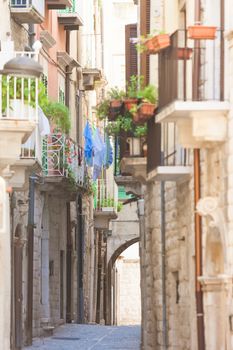 Molfetta, Apulia - Old balconies and a historical archway in an 
