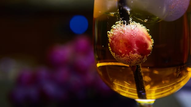 Grapes floating in champagne creating lots of bubbles