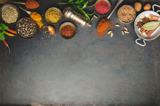 Herbs and spices on dark background