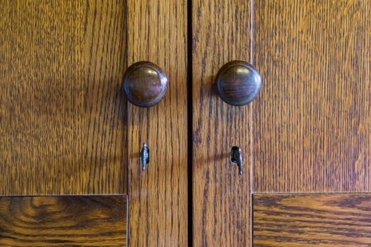 vintage wooden closet doors with door knobs and keys