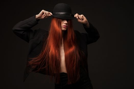 portrait of a beautiful woman with long red hair