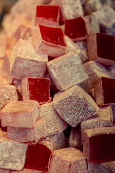 Turkish delight or lokum is a family of confections based on a gel of starch and sugar