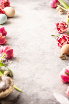 Spring flowers and Easter decorations on shabby chic background