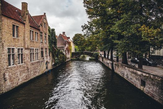Medieval channels of Bruges, detail of tourism in a city of Belgium