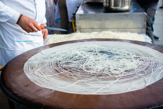 The making of Turkish desert Kadayif pastry