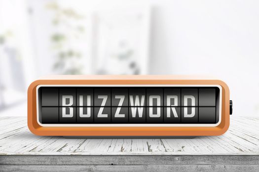 Analog device with the text buzzword on a wooden table in a bright living room