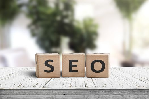 SEO word sign on a table in a bright room