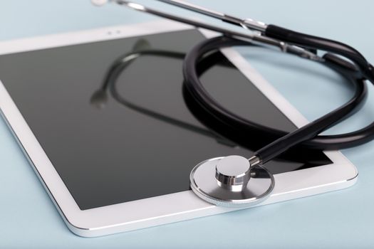 Black stethoscope and tablet
