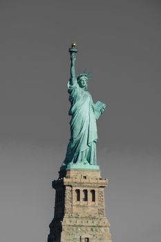 Statue of Liberty at perfect weather conditions blue sky copper