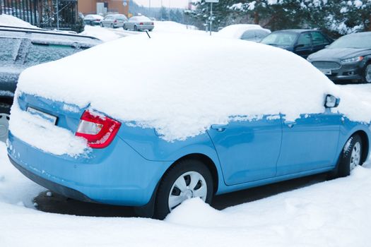 Winter frozen back car window, texture freezing ice glass background.