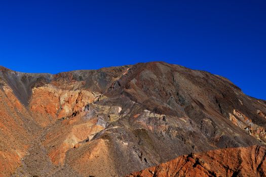 Moon Over Zabriskie Point Mudstones form Badlands Death Valley National Park California.