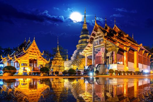 Wat Phra Singh temple at night in Chiang Mai, Thailand.