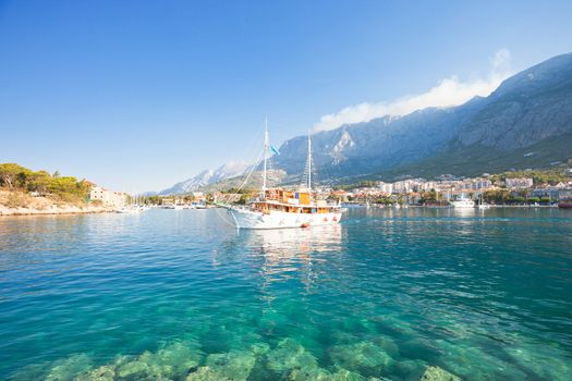 Makarska, Dalmatia, Croatia - A touristic party boat leaving the