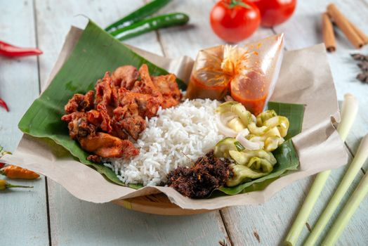 Nasi kukus ayam berempah, popular traditional Malay local food.