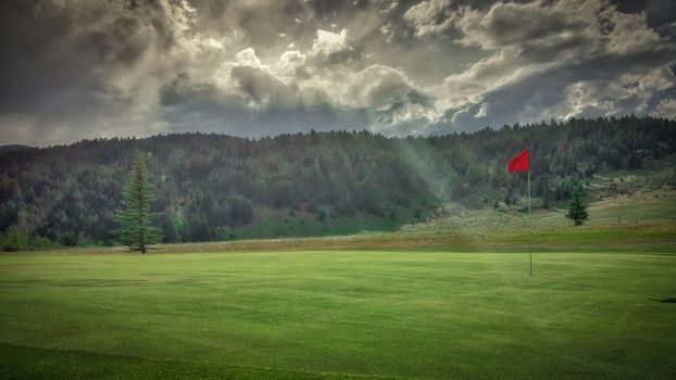Golf Hole with Sunbeam in Fairmont Springs Resort, Montana
