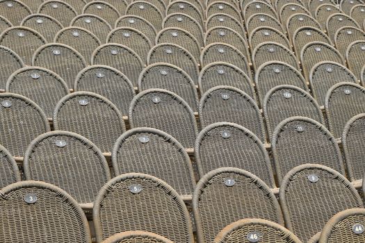 Rows of seats in open air concert hall auditorium