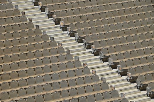 Rows of seats in open air concert hall auditorium