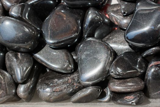 metallic gray tumbled hematite gemstone as  mineral rock