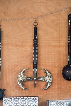 War axe and a mace on a wooden background