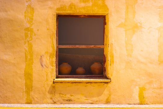 Old style pottery on the window background and copy space.