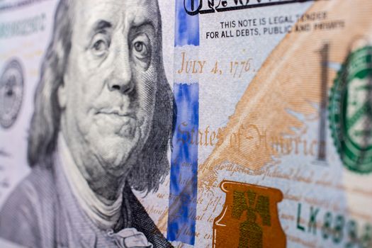 Close up of Benjamin Franklin face on US dollar