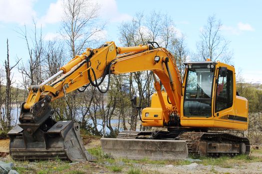 Excavator at earthmoving works