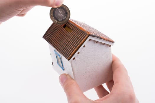 Moneybox in the shape of a model house