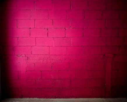 magenta color brick wall background with concrete floor