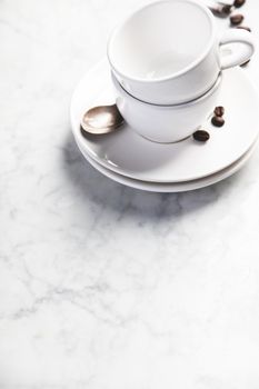 Coffee composition on white marble background, copyspace