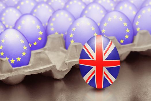 Concept of Brexit is presented from jumping egg with a British flag out of the box with eggs with the flag of the European Union