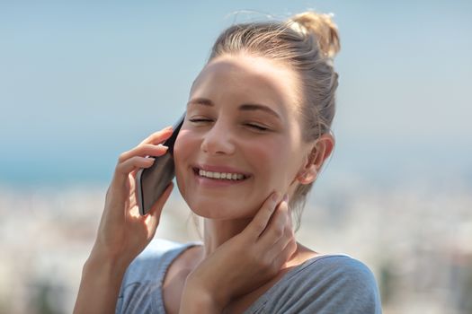 Cheerful girl talking on the phone