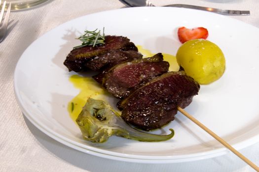 duck magret skewer with potatoe and artichoke for main dish