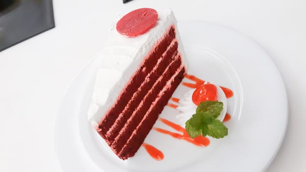 Red velvet cake on white plate.