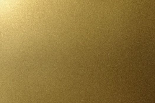 Light shining on golden metal plate, abstract texture background