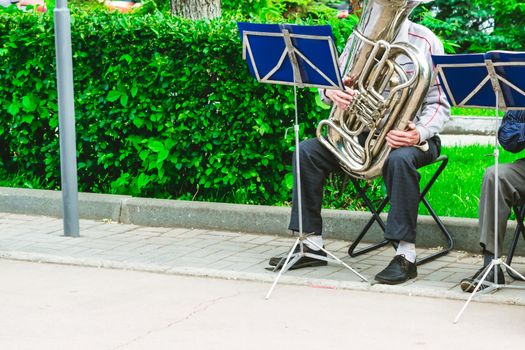 street musician with wind instrument in the Park