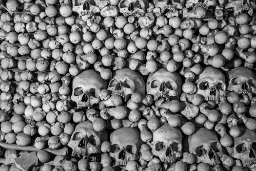 Human skulls and bones. Gothic vault. mass grave. Texture.
