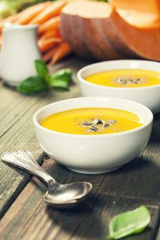 Vegetable or pumpkin soup and ingredients. Warm and comfy autumn concept.
