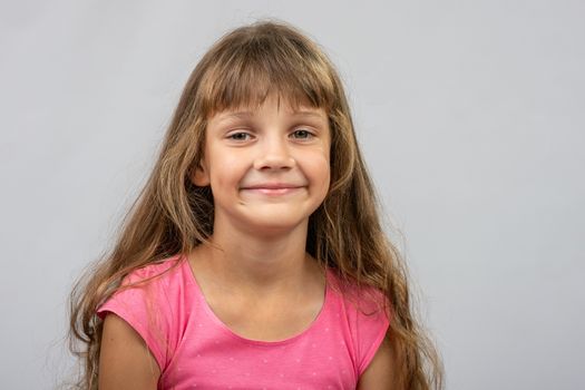 Portrait of a beautiful eight year old cheerful Europeans girl