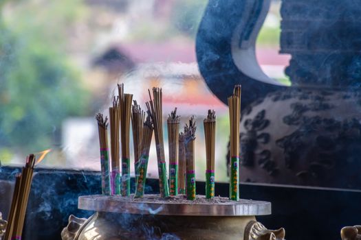 Incense stick joss sticks at buddhist temple in Asian