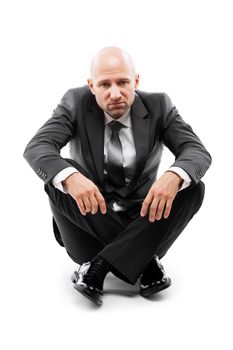 Tired or stressed businessman in depression sitting floor white isolated
