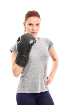 Portrait of a young girl with a boxing glove