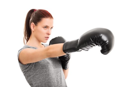 Young female boxer punching