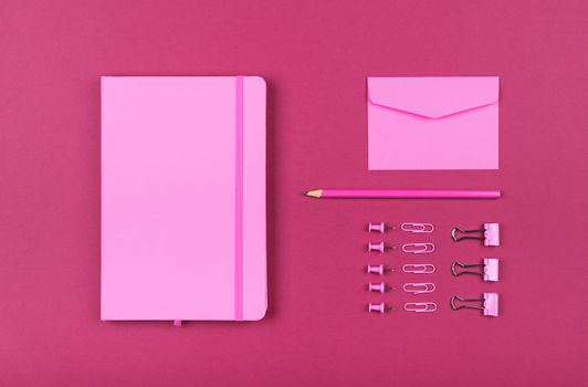 Neatly organized stationery flat lay of pink
