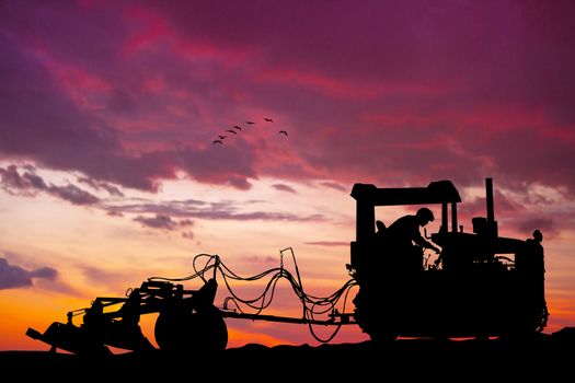 plow at sunset