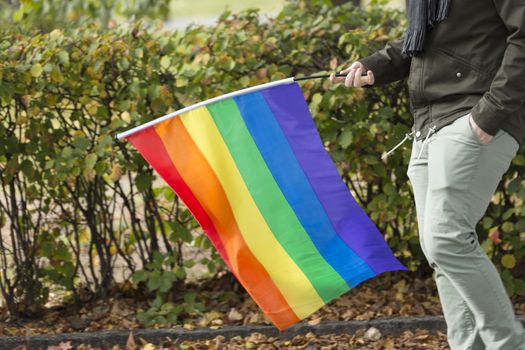Person Carrying Rainbow Flag
