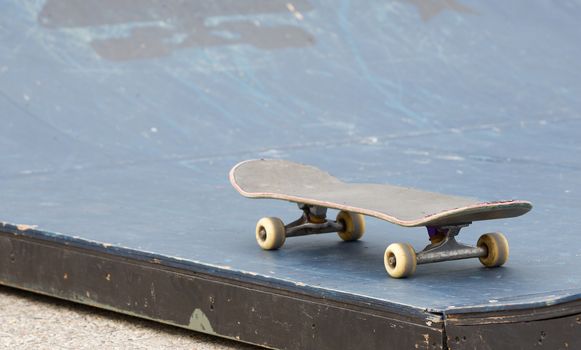 Skateboard isolated on a halfpipe