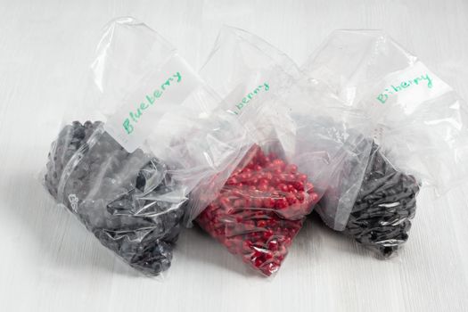 Berries laid out on a bags and prepared for freezing and storage